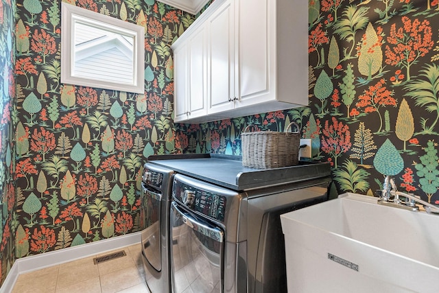 104 Majestic Ln, Franklin, TN 37064 - laundry area featuring wallpapered walls, cabinet space, washer and dryer, and tile patterned flooring