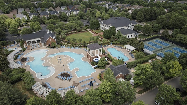 104 Majestic Ln, Franklin, TN 37064 - drone / aerial view of a pool area and a tree filled landscape
