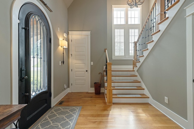 4310 Kings Camp Ct, Arrington, TN 37014 - foyer featuring healthy amount of natural light, light wood-style flooring, a towering ceiling, and stairs