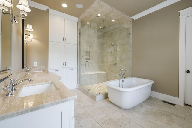 4310 Kings Camp Ct, Arrington, TN 37014 - full bathroom featuring a shower stall, double vanity, a freestanding tub, and recessed lighting