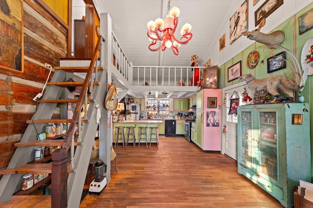 7139 Kingston Rd, Fairview, TN 37062 - stairs featuring a chandelier, wood finished floors, and vaulted ceiling