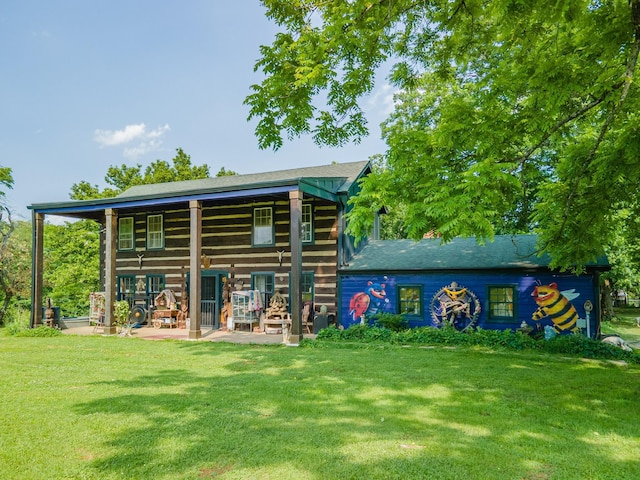 7139 Kingston Rd, Fairview, TN 37062 - rear view of house featuring a lawn