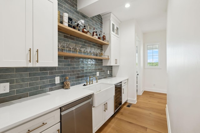 973 Hall Cemetery Rd, Burns, TN 37029 - kitchen with stainless steel dishwasher, wine cooler, open shelves, light wood-type flooring, and decorative backsplash