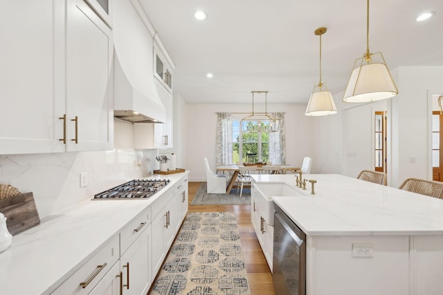 973 Hall Cemetery Rd, Burns, TN 37029 - kitchen with appliances with stainless steel finishes, light wood-style floors, recessed lighting, decorative backsplash, and white cabinetry