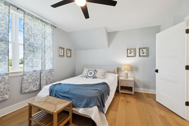 973 Hall Cemetery Rd, Burns, TN 37029 - bedroom featuring light wood-style floors, ceiling fan, and lofted ceiling