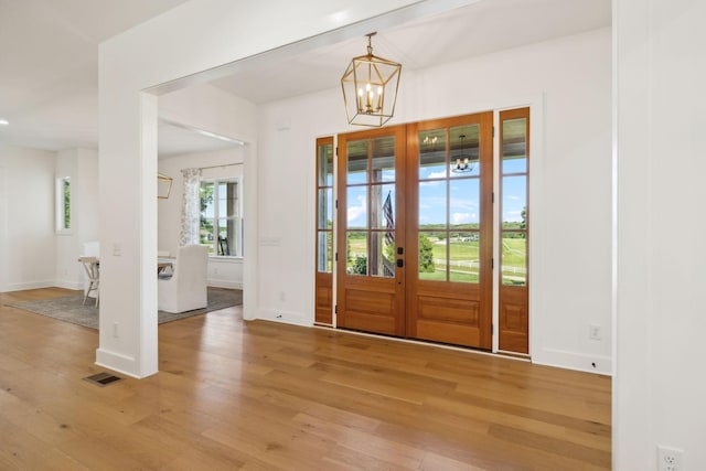 973 Hall Cemetery Rd, Burns, TN 37029 - foyer entrance featuring light wood finished floors and a chandelier