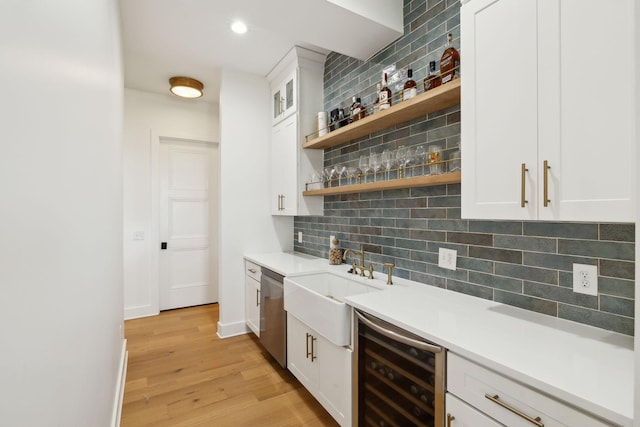 973 Hall Cemetery Rd, Burns, TN 37029 - indoor wet bar featuring wine cooler, tasteful backsplash, light wood-style flooring, stainless steel dishwasher, and recessed lighting