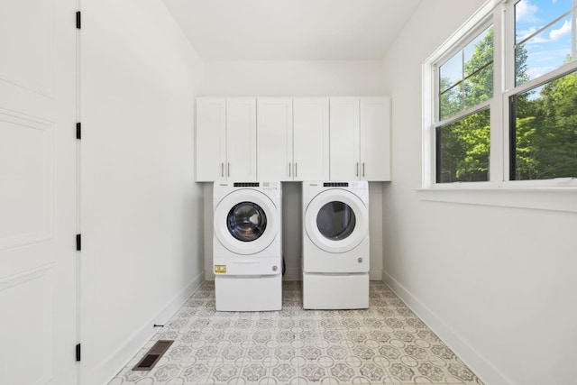 973 Hall Cemetery Rd, Burns, TN 37029 - laundry area with independent washer and dryer, cabinet space, and light floors