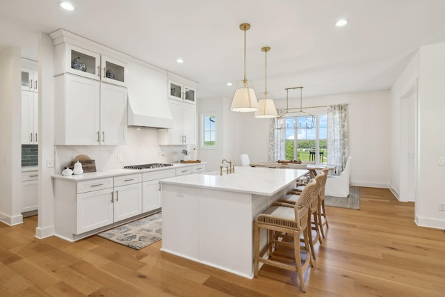 973 Hall Cemetery Rd, Burns, TN 37029 - kitchen featuring recessed lighting, light wood-type flooring, white cabinets, and backsplash
