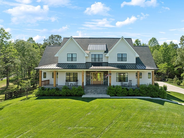 973 Hall Cemetery Rd, Burns, TN 37029 - modern farmhouse style home featuring a standing seam roof, covered porch, and a metal roof