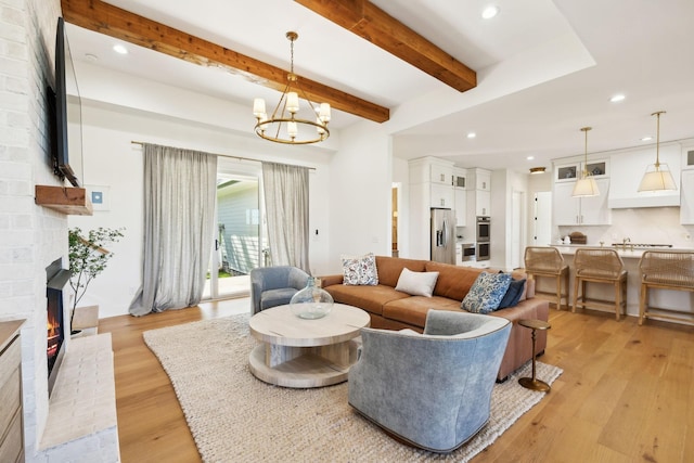 973 Hall Cemetery Rd, Burns, TN 37029 - living area with recessed lighting, light wood-type flooring, a fireplace, a chandelier, and beamed ceiling