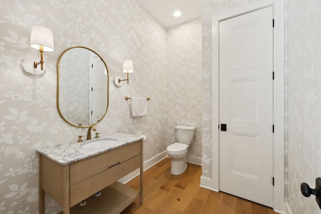 973 Hall Cemetery Rd, Burns, TN 37029 - bathroom featuring wood finished floors, wallpapered walls, and vanity