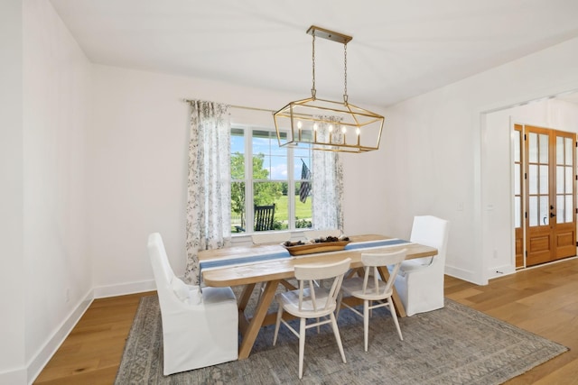 973 Hall Cemetery Rd, Burns, TN 37029 - dining area featuring a chandelier and wood finished floors