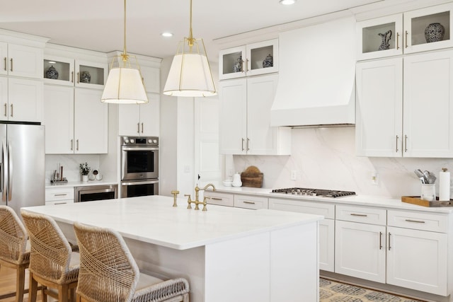 973 Hall Cemetery Rd, Burns, TN 37029 - kitchen featuring appliances with stainless steel finishes, custom range hood, decorative backsplash, recessed lighting, and a kitchen breakfast bar