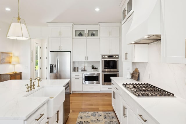 973 Hall Cemetery Rd, Burns, TN 37029 - kitchen featuring custom exhaust hood, appliances with stainless steel finishes, decorative backsplash, recessed lighting, and white cabinets