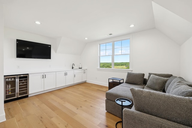 973 Hall Cemetery Rd, Burns, TN 37029 - living area featuring wine cooler, wet bar, vaulted ceiling, light wood-style flooring, and recessed lighting