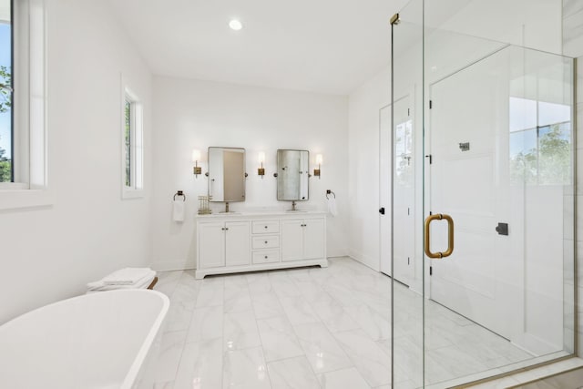 973 Hall Cemetery Rd, Burns, TN 37029 - full bathroom featuring double vanity, a freestanding tub, a stall shower, marble finish flooring, and recessed lighting