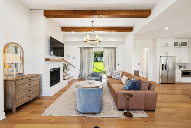973 Hall Cemetery Rd, Burns, TN 37029 - living area with light wood-style flooring, a brick fireplace, a chandelier, beamed ceiling, and recessed lighting
