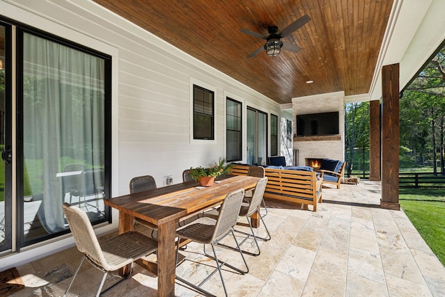 973 Hall Cemetery Rd, Burns, TN 37029 - view of patio with an outdoor living space with a fireplace, a ceiling fan, and outdoor dining area