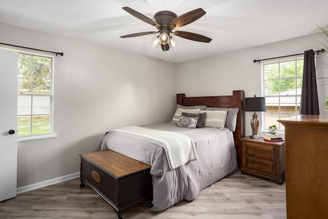 1808 Nassau Blvd, Florence, AL 35630 - bedroom with multiple windows, light wood finished floors, and ceiling fan