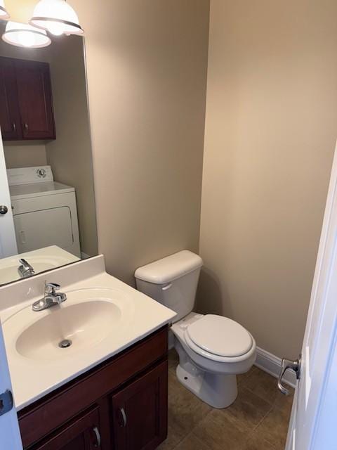 135 Excell Rd Unit 102, Clarksville, TN 37043 - bathroom with washer / dryer, vanity, and tile patterned flooring