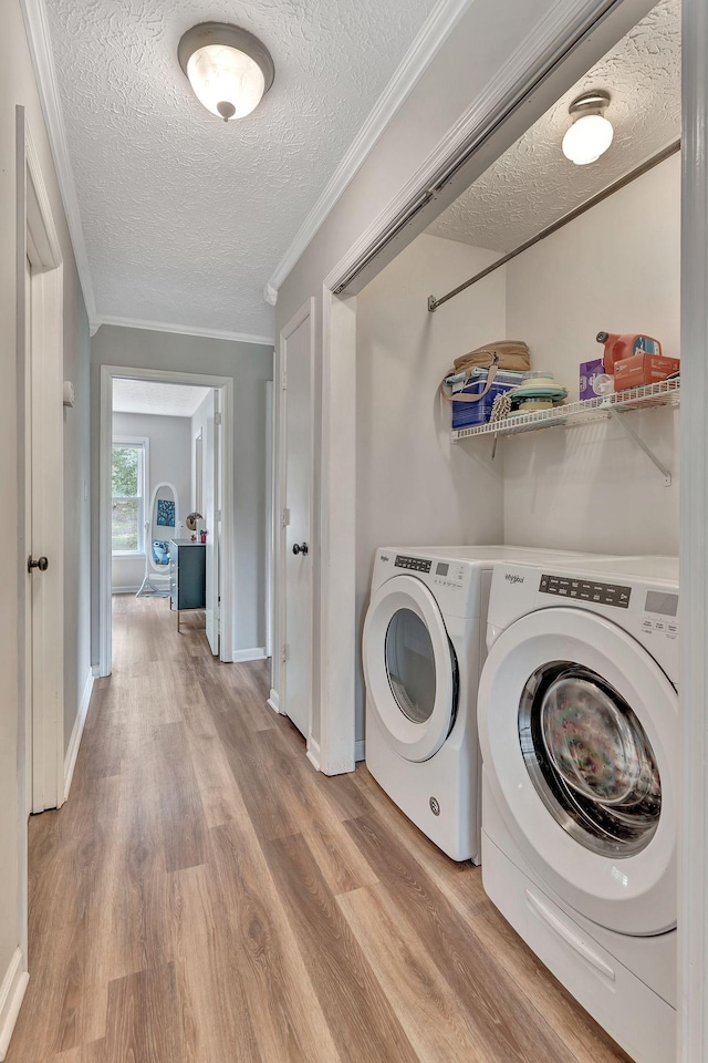 141 Springbrook Pl, Joelton, TN 37080 - laundry area with a textured ceiling, washer and dryer, wood finished floors, and ornamental molding