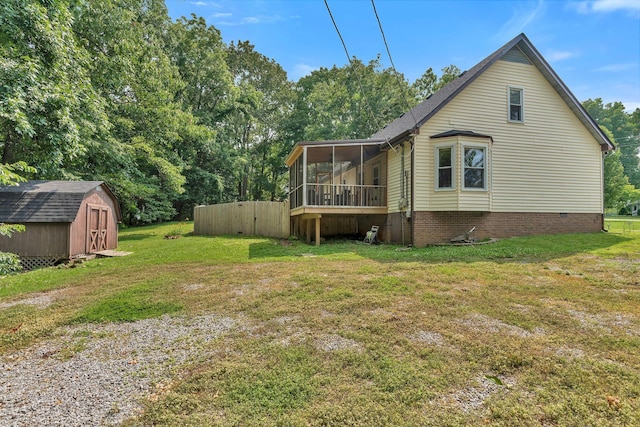 141 Springbrook Pl, Joelton, TN 37080 - view of side of home featuring a sunroom, a storage unit, and a lawn