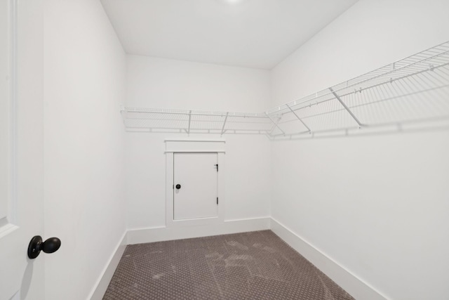 5128 Terravista Ln, Franklin, TN 37064 - walk in closet featuring dark carpet