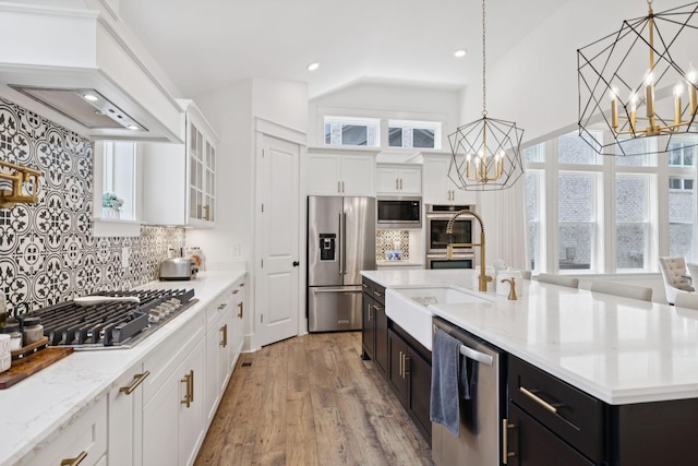 5128 Terravista Ln, Franklin, TN 37064 - kitchen with stainless steel appliances, a chandelier, white cabinetry, healthy amount of natural light, and recessed lighting