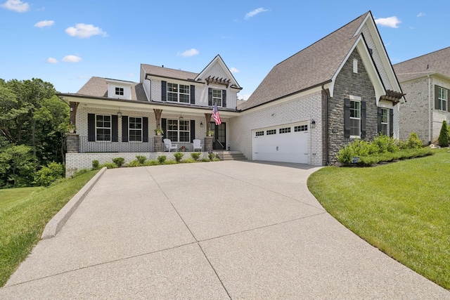 5128 Terravista Ln, Franklin, TN 37064 - view of front facade featuring covered porch, an attached garage, a front lawn, brick siding, and driveway