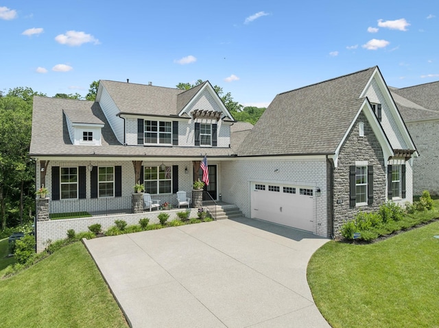 5128 Terravista Ln, Franklin, TN 37064 - view of front of house with an attached garage, a porch, concrete driveway, a front lawn, and a shingled roof
