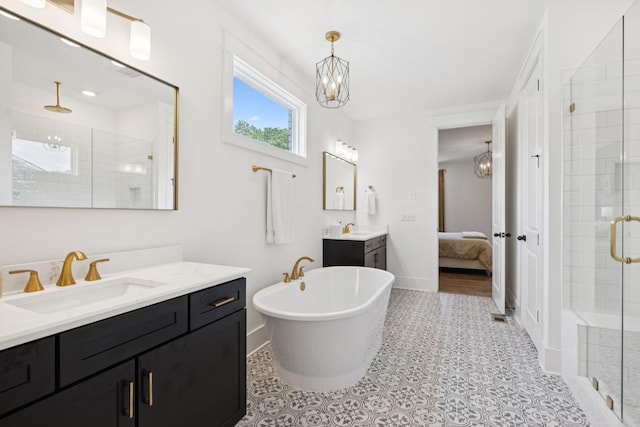 5128 Terravista Ln, Franklin, TN 37064 - full bathroom with a shower stall, a chandelier, two vanities, and a freestanding tub