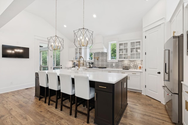 5128 Terravista Ln, Franklin, TN 37064 - kitchen with high end fridge, custom exhaust hood, light countertops, white cabinets, and recessed lighting
