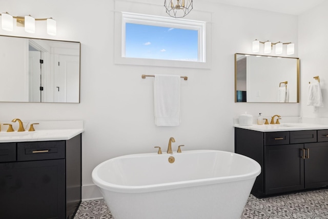 5128 Terravista Ln, Franklin, TN 37064 - full bath featuring two vanities, a freestanding tub, and tile patterned floors