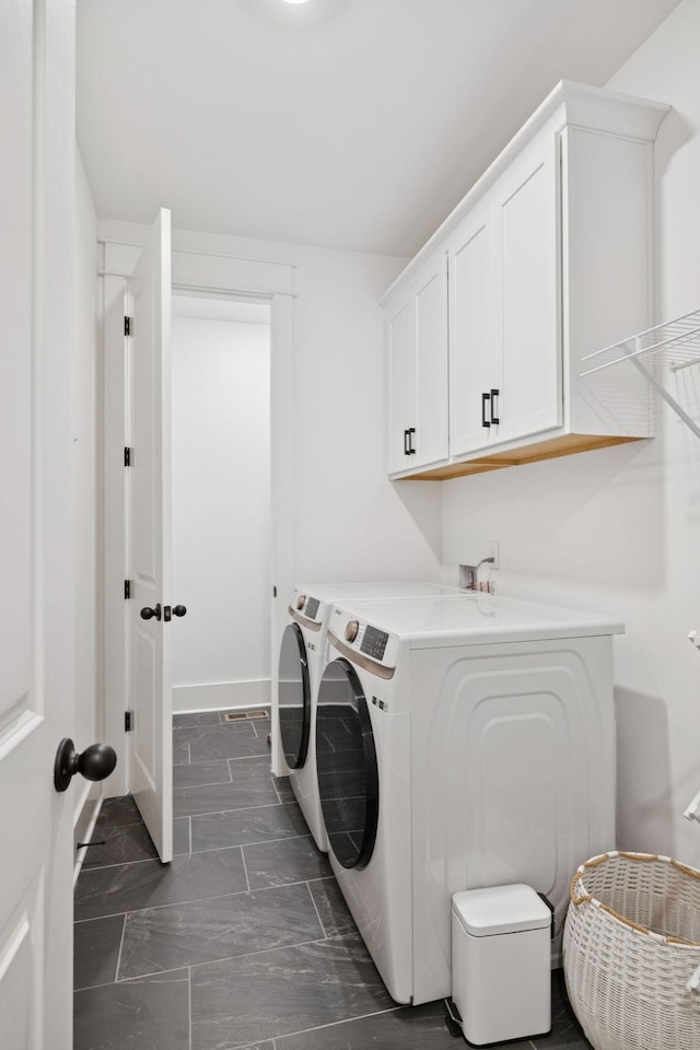 5128 Terravista Ln, Franklin, TN 37064 - washroom featuring washing machine and clothes dryer and cabinet space