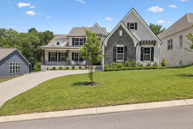 5128 Terravista Ln, Franklin, TN 37064 - view of front facade featuring a front lawn, stone siding, and concrete driveway
