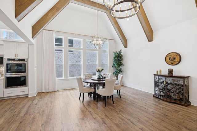 5128 Terravista Ln, Franklin, TN 37064 - dining room featuring a chandelier, beamed ceiling, high vaulted ceiling, and light wood-type flooring