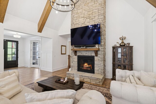 5128 Terravista Ln, Franklin, TN 37064 - living room with high vaulted ceiling, wood finished floors, and a stone fireplace