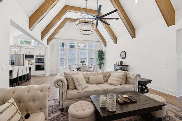 5128 Terravista Ln, Franklin, TN 37064 - living room with a chandelier, beamed ceiling, high vaulted ceiling, light wood finished floors, and recessed lighting