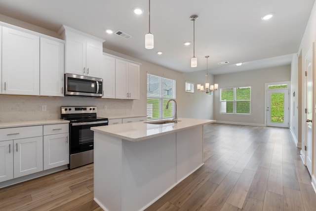 270 Netherlands Blvd, Lebanon, TN 37090 - kitchen featuring stainless steel appliances, a chandelier, backsplash, white cabinetry, and recessed lighting