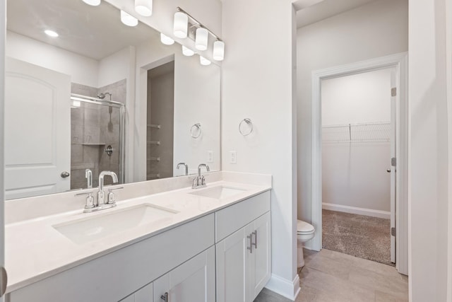 270 Netherlands Blvd, Lebanon, TN 37090 - bathroom featuring a shower stall, double vanity, a spacious closet, tile patterned floors, and recessed lighting