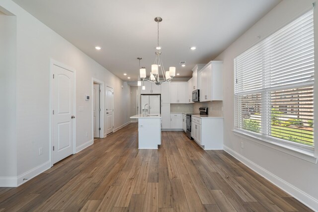270 Netherlands Blvd, Lebanon, TN 37090 - kitchen with appliances with stainless steel finishes, a chandelier, light countertops, dark wood-style floors, and recessed lighting