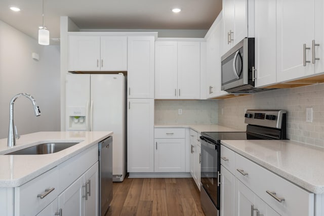 270 Netherlands Blvd, Lebanon, TN 37090 - kitchen with appliances with stainless steel finishes, recessed lighting, decorative light fixtures, decorative backsplash, and white cabinetry