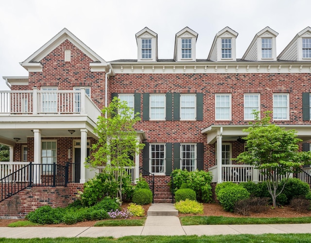2003 Rural Plains Cir, Franklin, TN 37064 - view of front facade featuring a balcony, brick siding, and covered porch