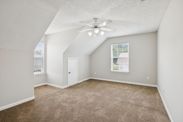 1882 Portway Rd, Spring Hill, TN 37174 - bonus room featuring carpet flooring, a textured ceiling, a ceiling fan, and vaulted ceiling