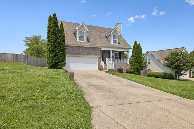 1882 Portway Rd, Spring Hill, TN 37174 - cape cod house featuring covered porch, driveway, brick siding, a chimney, and roof with shingles