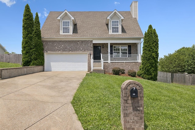 1882 Portway Rd, Spring Hill, TN 37174 - cape cod home with brick siding, concrete driveway, a garage, covered porch, and a chimney