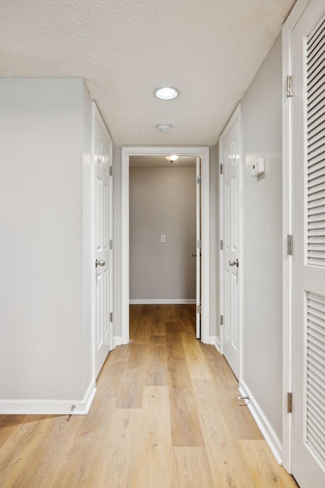 1882 Portway Rd, Spring Hill, TN 37174 - hallway with light wood-style flooring, a textured ceiling, and recessed lighting