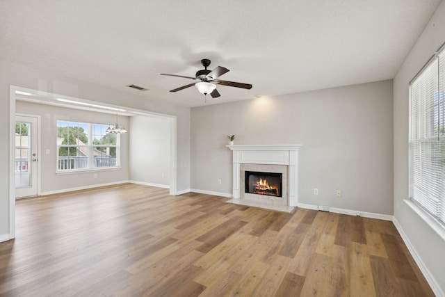 1882 Portway Rd, Spring Hill, TN 37174 - unfurnished living room featuring ceiling fan, light wood-style floors, and plenty of natural light