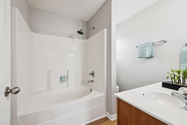 1882 Portway Rd, Spring Hill, TN 37174 - full bathroom featuring vanity, bathtub / shower combination, wood finished floors, and a textured ceiling